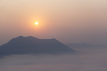 Closeup silhouette sun rise in the morning, tourism concept