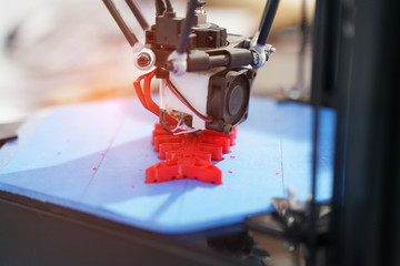 Automatic three dimensional 3D printer machine printing plastic model of fish skeleton