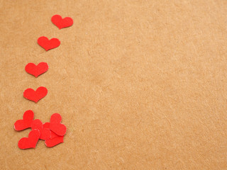 Fototapeta premium Many red heart on kraft paper background for Valentine's day..