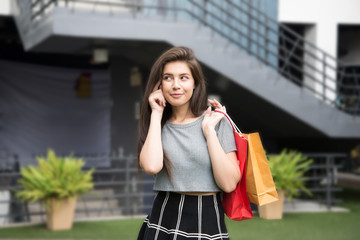 Beautiful girl hands hold shopping bag smile