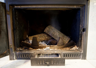 old, dirty and constantly used fireplace in the house
