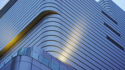 Textures from the facades of night buildings. geometric texture. modern architecture, illumination. composition of curved shapes