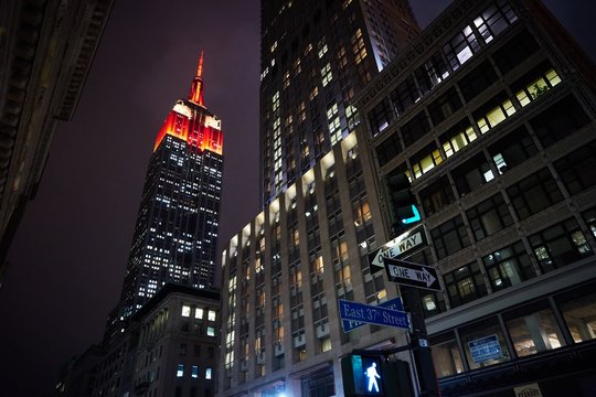 Low Angle View Of Illuminated Empire State Building In City At Dusk