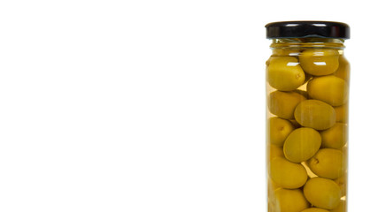 Glass jar with green olives. Canning supply food.