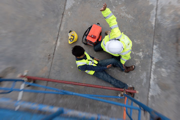 Accident at work of Maintenance worker on steel walkway in factory. Add zoom filter effect for feelings.