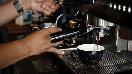 barista making coffee