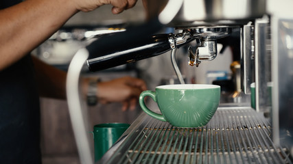 barista making coffee