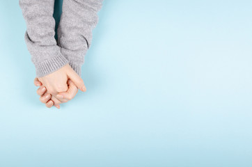 Woman hands in pullover gesture, flat lay.