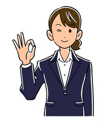 手でOKのサインを出すビジネスウーマンの上半身