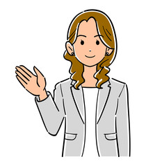 手のひらを右側に向ける、グレーのジャケットを羽織ったビジネスウーマンの上半身