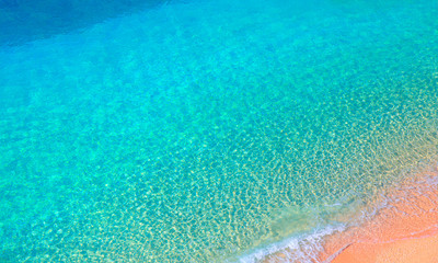 Fototapeta na wymiar Clear water sea and orange sand beach - Kaputas Beach, Mediterranean Sea, Antalya