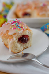 sweet home made Carnival powdered sugar raised donuts with paper streamers