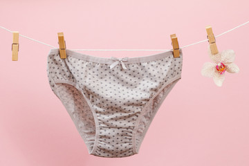 Beautiful women's cotton panties on pink background.