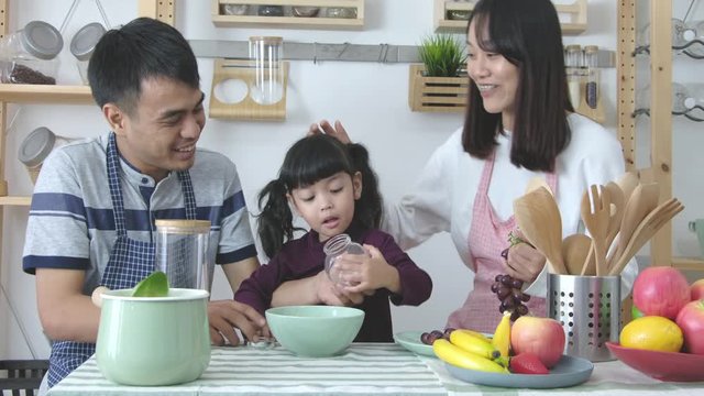 Parent play in kitchen with daughter, lovely family