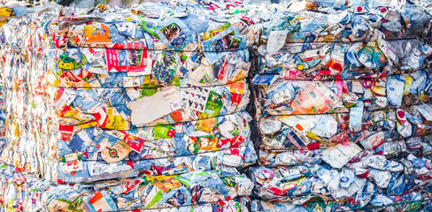 Recycling and storage of waste for further disposal, trash sorting. Picture of recycled plastic waste pressed to bales. Plastic bottles,compressed