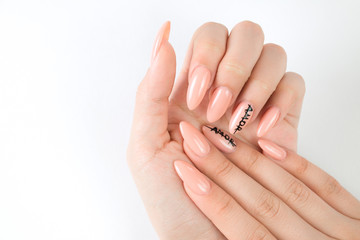 Manicured girl hands on a white background. Pink coral nails