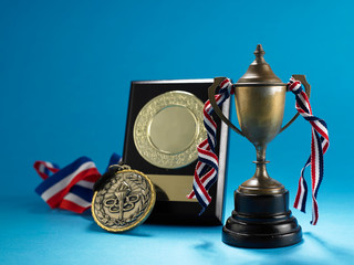 trophy medal and plaque on the blue background