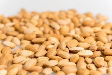 a lot of nuts close-up. unpeeled almonds. natural background for healthy eating concept