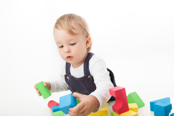 playing with colored blocks, toddler