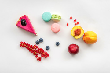 Sweets, fruits and berries on white background for coffee