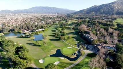 Aerial view of golf course with green field in the valley. Green turf scenery. Temecula, California, USA