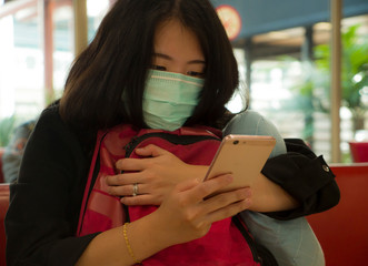 young beautiful tourist Asian Korean tourist girl at airport wearing protective facial mask...