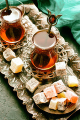 Turkish  tea and turkish delight  on  traditional embossed metal tray