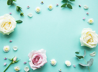 Naklejka na ściany i meble Flowers composition on green background