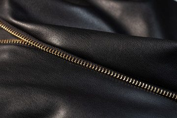 the texture is smooth black leather