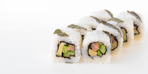 Set of Sushi rolls with cream cheese and salmon inside isolated on a white background.
