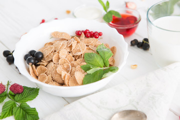 Multigrain wholewheat healthy cereal. Healthy tasty breakfast multigrain wholewheat healthy cereals with strawberries, raspberries, black currants and red currants.