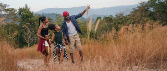 african american family having fun traveling and camping together in natural forest and park - obrazy, fototapety, plakaty