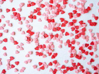 Colored sugar hearts sprinkles background, Sugar sprinkle hearts, decoration for cake and bakery, lot of sprinkles as a background. top view