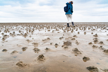 WALKING ON THE WADDEN SEA ON SYLT.