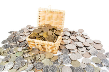A treasure of money coins lies in and around the chest.