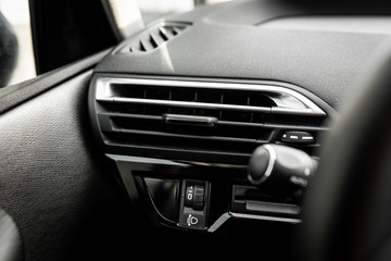 Fototapeta na wymiar Car air conditioning panel on the luxury car console. Car climate control.