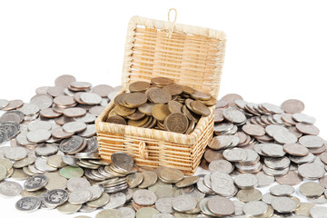 A treasure of money coins lies in and around the chest.