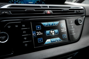 Car air conditioning panel on the luxury car console. Car climate control.