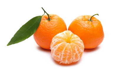 Mandarins and peeled pieces with leaf isolated on white background