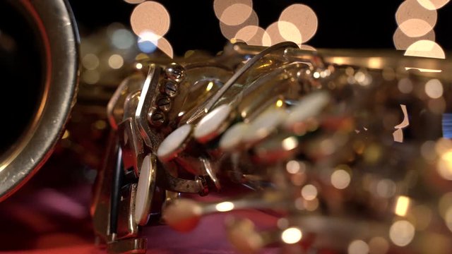 Close up of a vintage golden alto saxophone (rotating view)