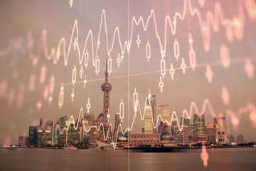 Forex chart on cityscape with tall buildings background multi exposure. Financial research concept.