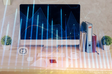 Forex graph hologram on table with computer background. Double exposure. Concept of financial markets.