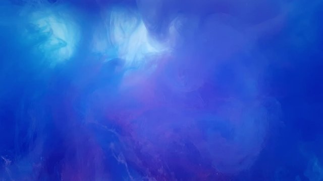 A beautiful mix of acrylic ink in water. The blue and pink ink forms abstract clouds when mixed. Acrylic clouds on a white background. Slow motion