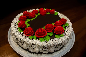 a birthday cake decorated with roses
