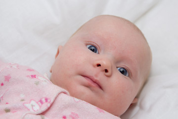 baby with blue eyes,beautiful newborn baby girl with blue eyes with round face