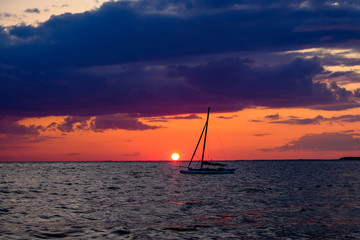Fototapeta premium Sunset far beyond horizon after a beautiful summer day on Cape Cod`s popular and endless beaches (Massachusetts, USA).