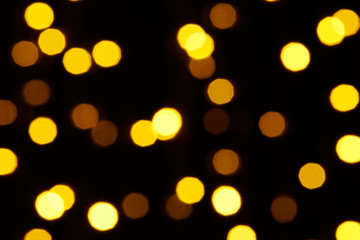 abstract background - photo of yellow bokeh on a black