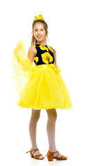 Little girl in an elegant dress.The concept of a happy childhood