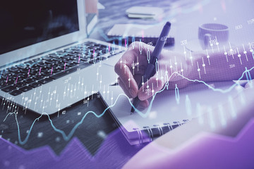 Forex chart displayed on woman's hand taking notes background. Concept of research. Multi exposure