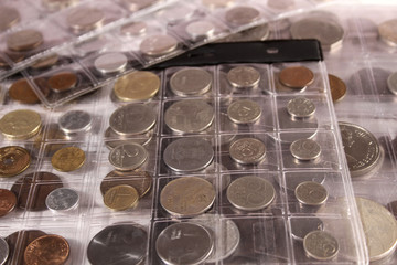 Many coins of different countries and times. Numismatics